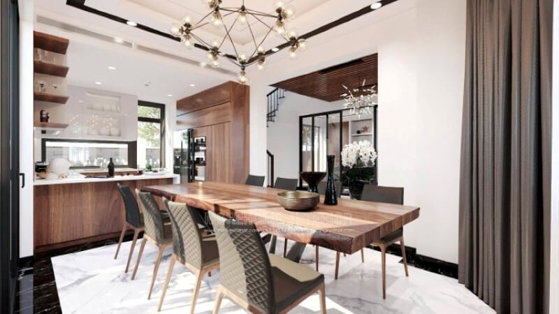 Ngoài điểm đặc biệt từ cách bố trí kệ trang trí, bàn đảo bằng đá nhân tạo màu trắng được thiết kế phô ra ngoài lại là điểm đáng chú ý, một mặt vẫn đảm bảo diện tích để chủ nhân có thể trưng bày món ăn thỏa mái, một mặt bạn lại có thể vừa nội trợ vừa có thể trông nom con học một cách dễ dàng. Thiết kế phòng bếp đẹp