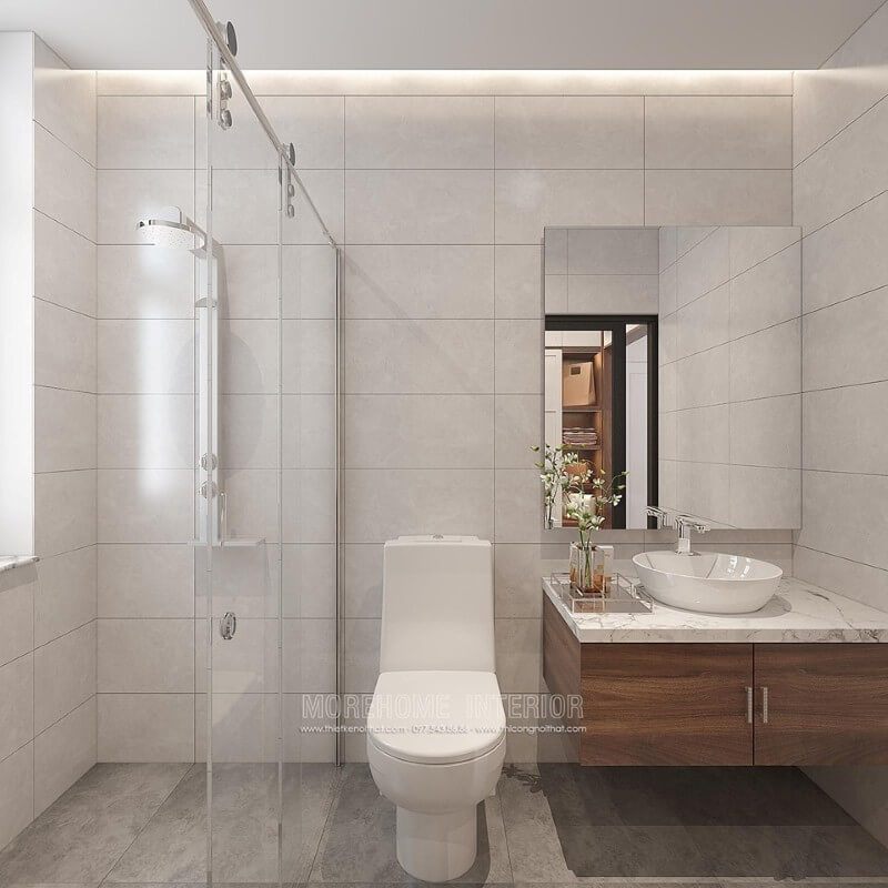 Bạn đang muốn sở hữu mẫu thiết kế phòng tắm đơn giản đẹp, ý tưởng sử dụng vách tắm kính cửa trượt giúp không gian trở nên thông thoáng, tiện ích, gương ốp tường không bo viền, tường đơn sắc nhưng tổng hòa lại tạo nên bức tranh sang trọng ấn tượng.